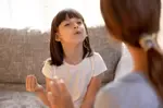 Girl imitating teacher