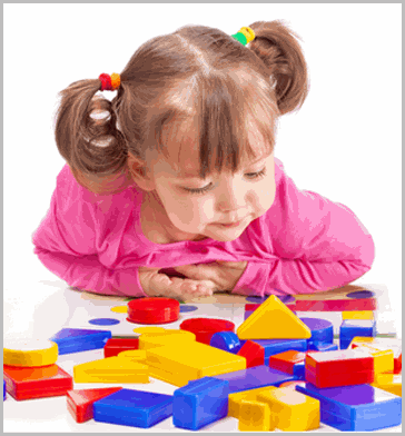 Little girl playing with blocks