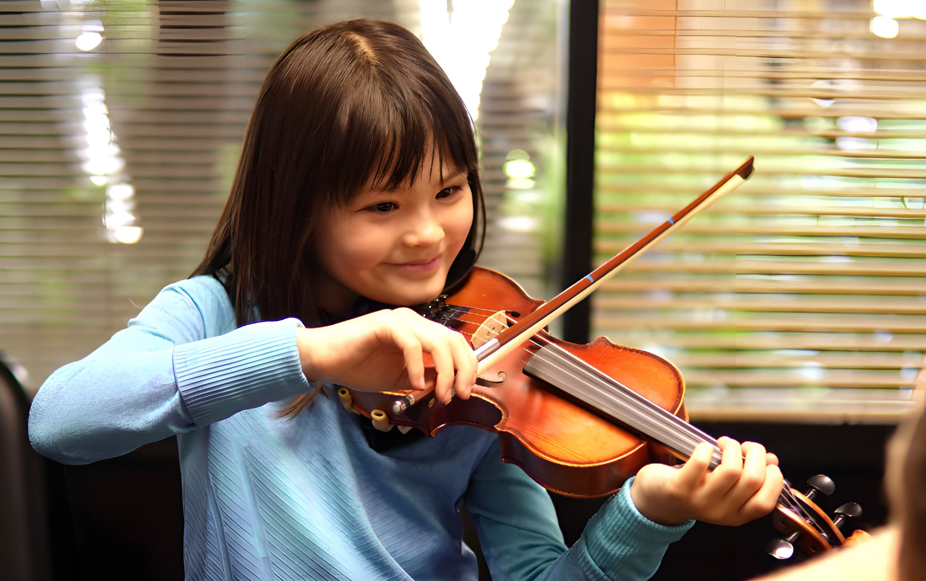 Violin lessons make this girl happy!
