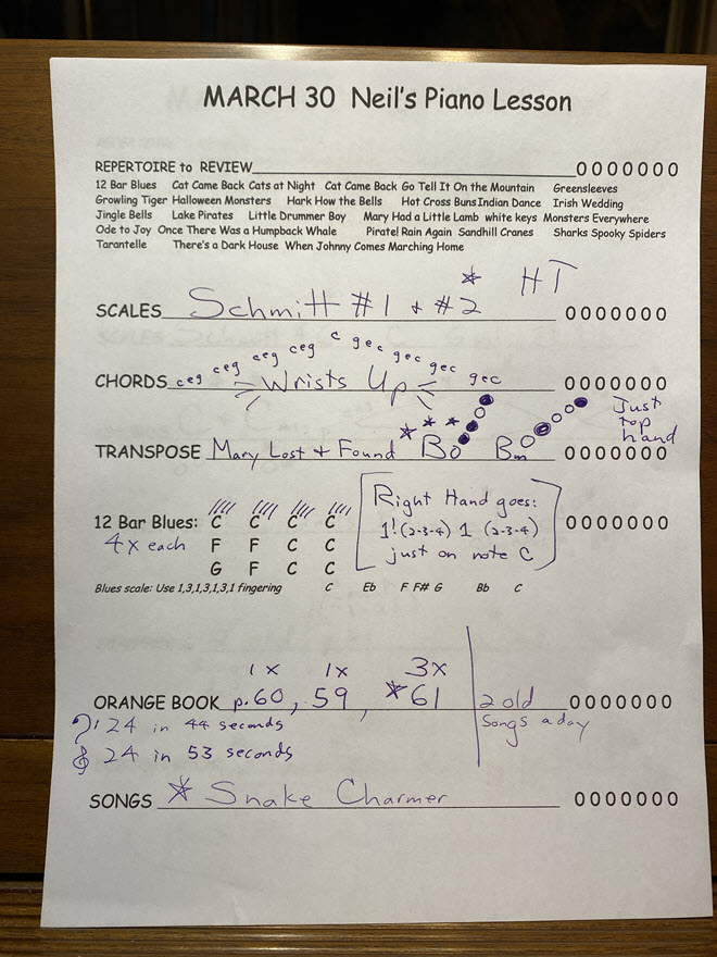 Piano student's lesson sheet with assignments