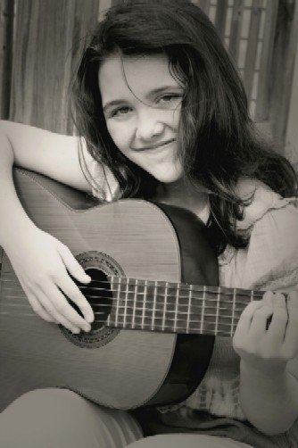 Pretty girl playing guitar